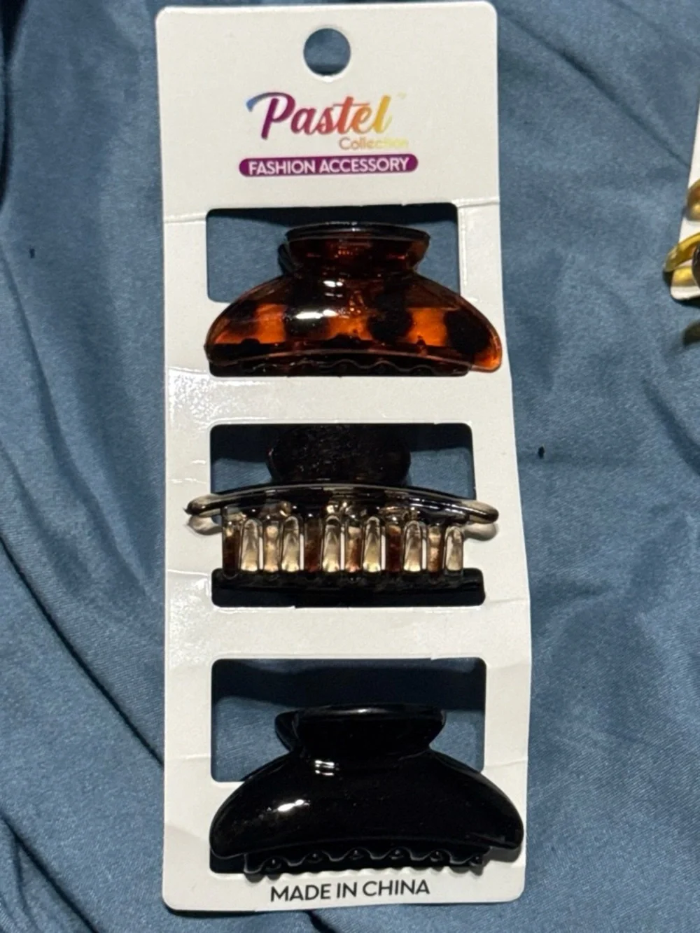 Assortment of Multi-colored hair claw clips.